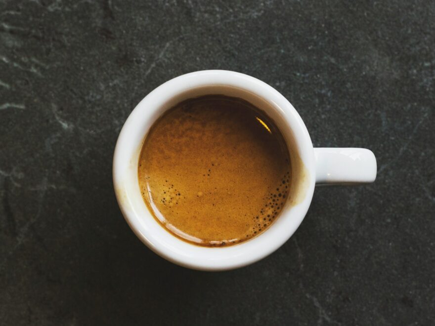 white ceramic mug fill with coffee